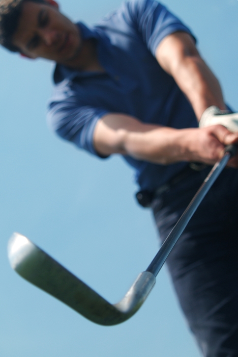 Golfer Lining Up His Iron Shot