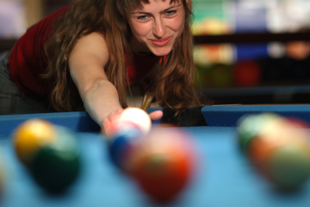 Female Pool Player Lines Up a Shot