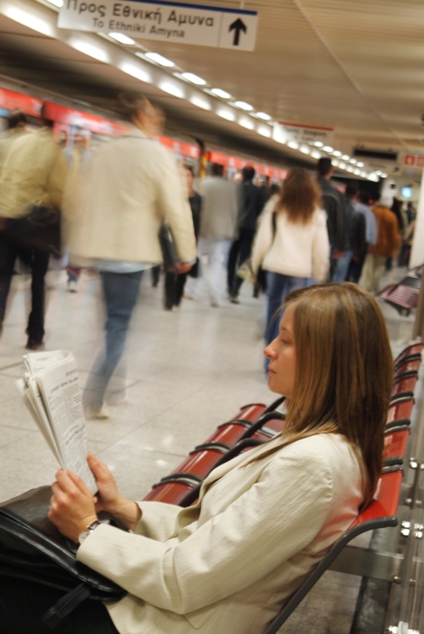 Female Passenger Waiting For Her Train