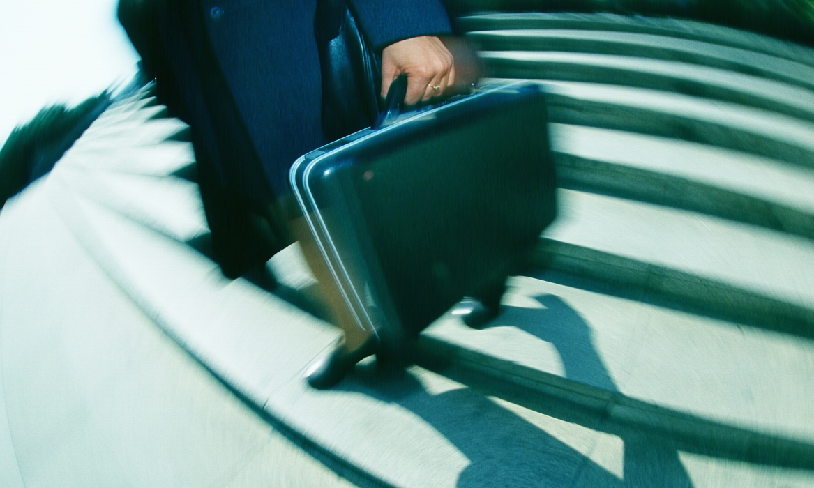 Businesswoman Walking Down Stairs