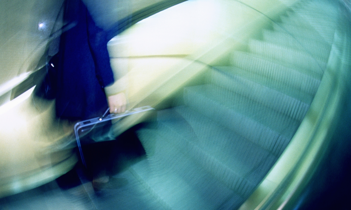 Businesswoman Walking Down Stairs