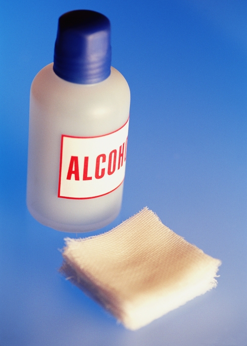 Bottle of Alcohol, Stack of Squares of Gauze