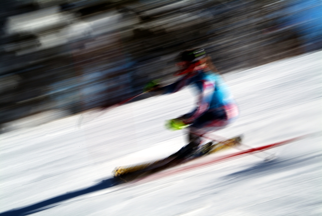 Downhill Skier Skiing in Race