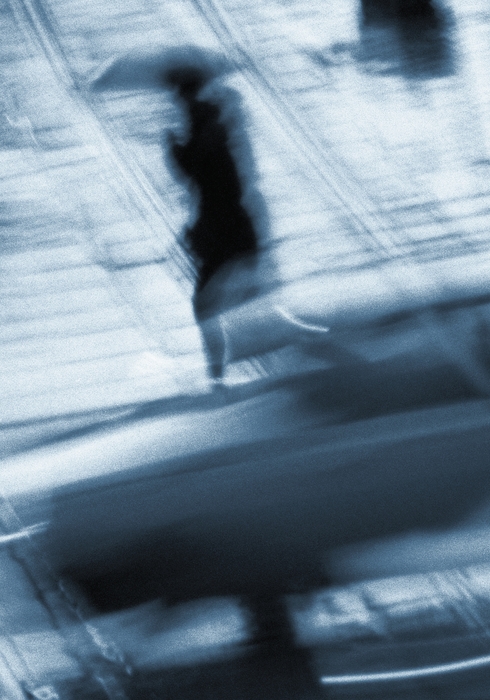 Businesswoman Walking in The Rain