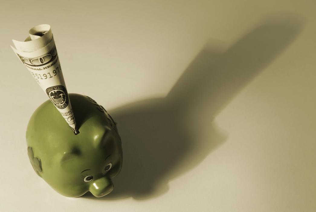 Piggy Bank with Money Deposit with Dramatic Shadow