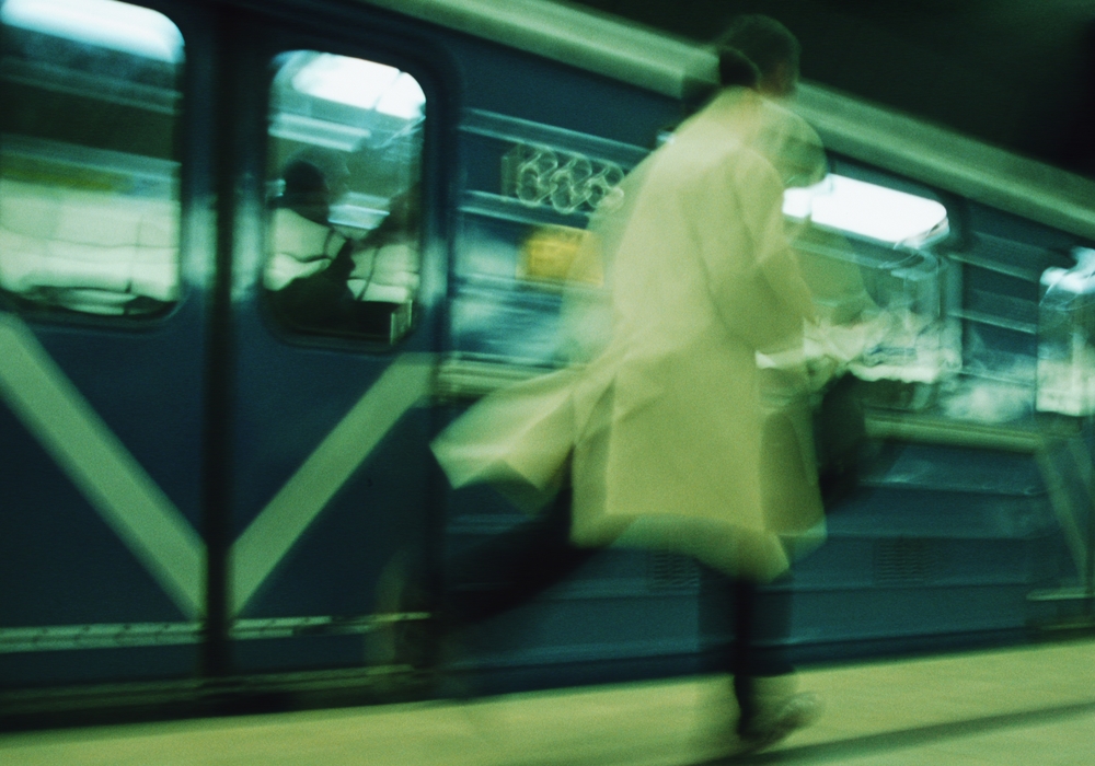 Businessman Running For The Subway