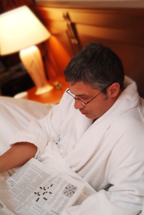 Businessman Reading Paper in Robe