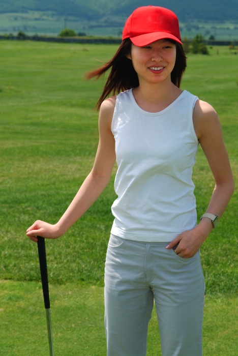 Female Golfer Waiting For Shot