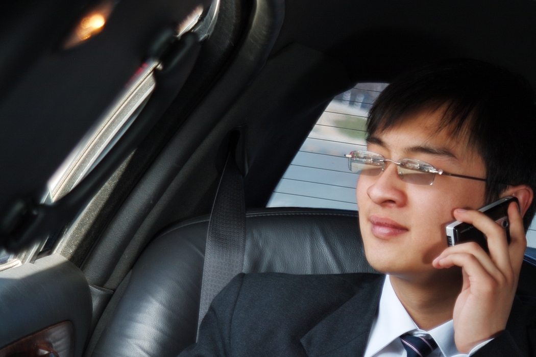 Man Talking on a Cell Phone in Limo