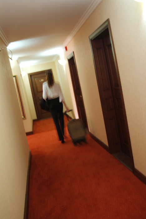 Businesswoman Leaving Hotel Room