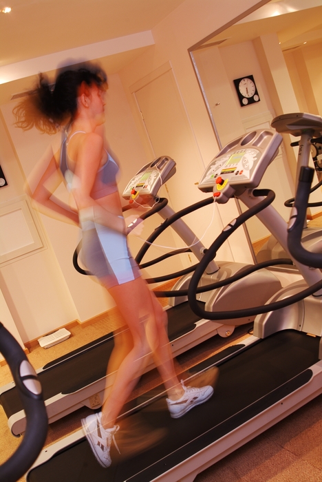 Woman Running on the Treadmill