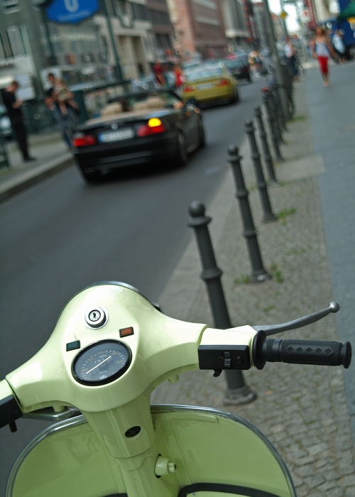 Motor Scooter Parked on Sidewalk