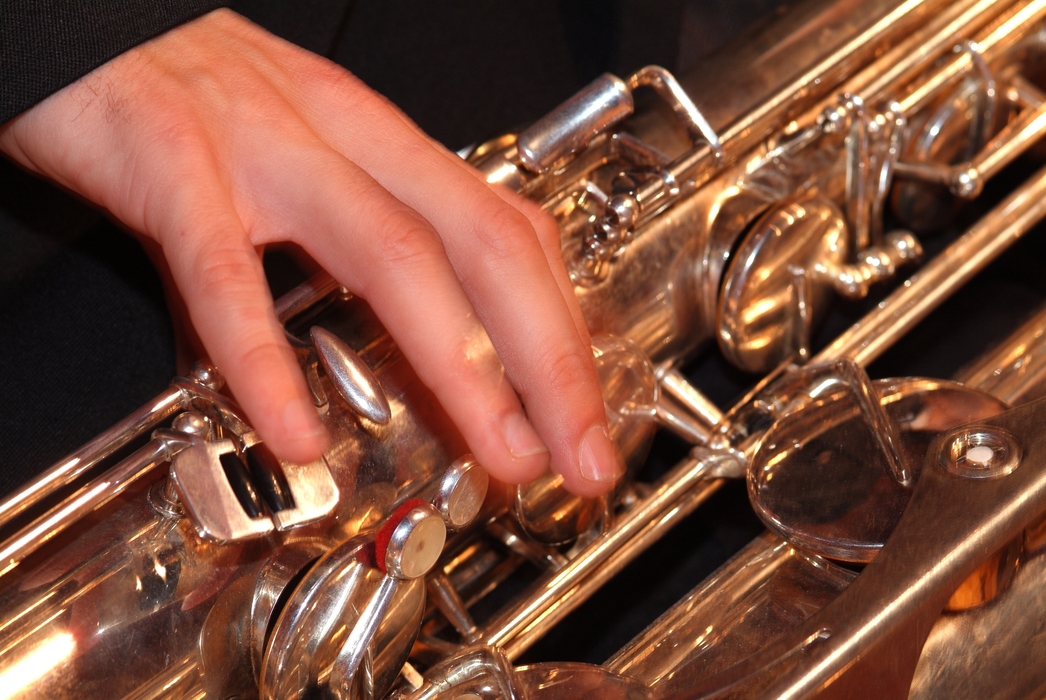 Symphony Orchestra Saxophonist Fingers on Keys