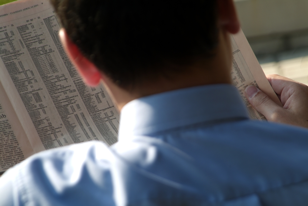 Businessman Reading the Stock Report