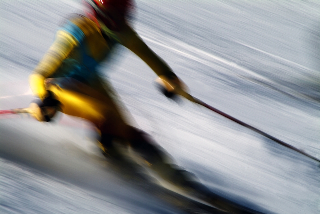 Downhill Skier Races Past the Camera During Ski Race