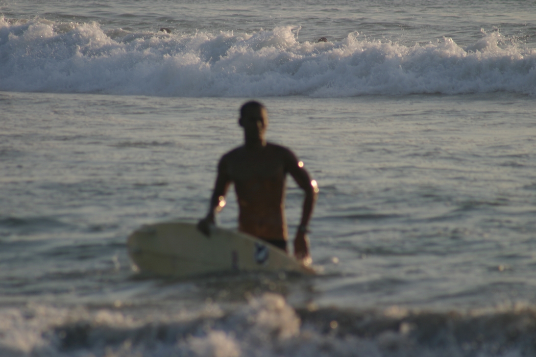 Surfer with Board in the Ocean