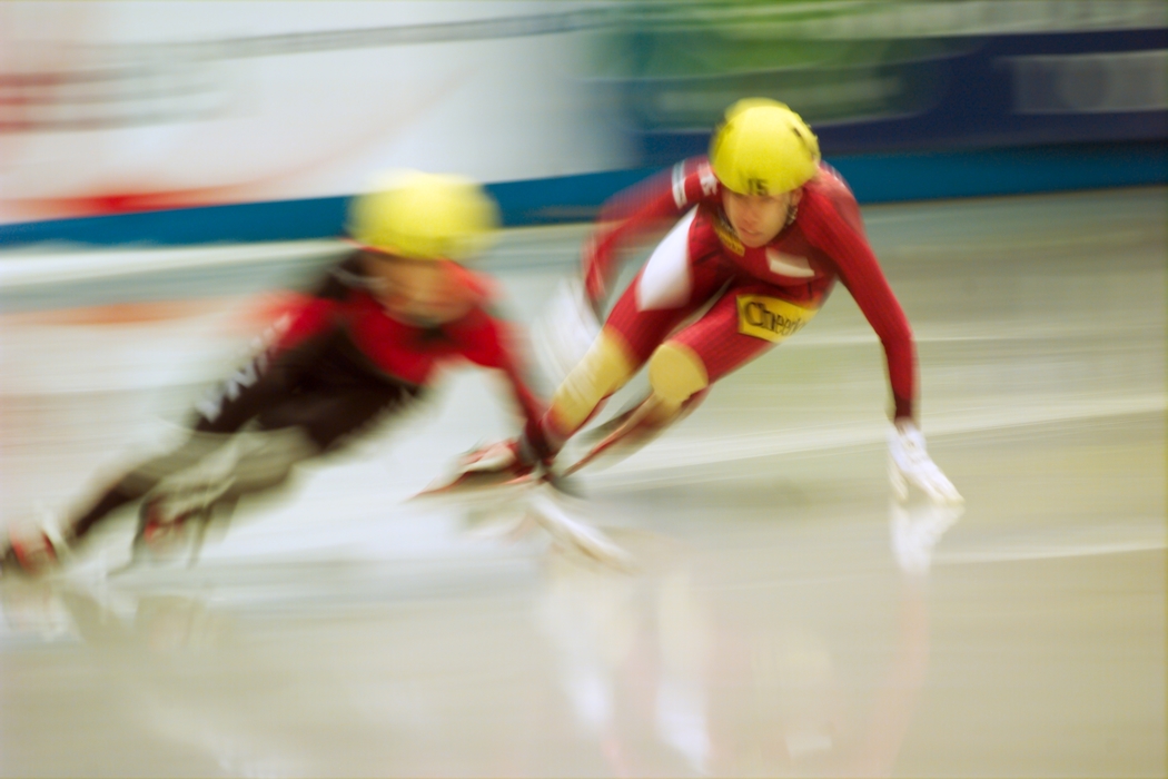 Speed Skaters Rounding a Turn