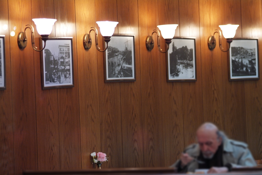 Man Having Dinner in Café