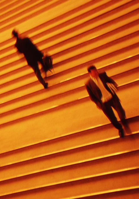 Business People Going Up Stairs