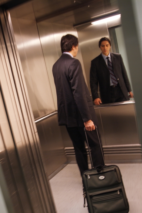 Man Taking His Luggage to His Room