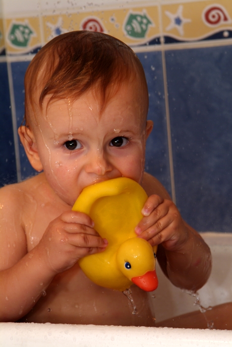 Baby Playing in the Bath with Rubber Duck