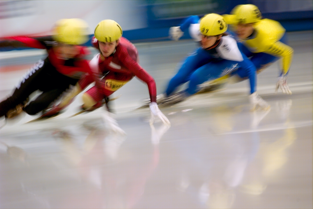Four Speed Skaters in Close Competition