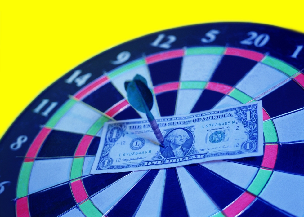 Dartboard with $ Bill At Bulls Eye, Pinned with a Dart