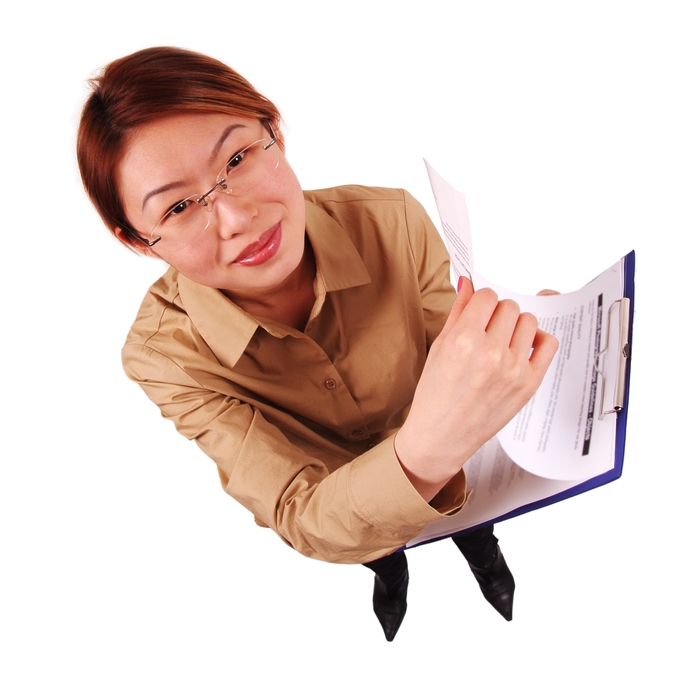 Businesswoman Checking Paperwork