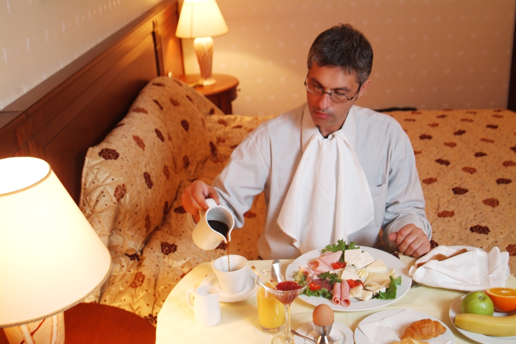 Businessman Eating Breakfast in Room