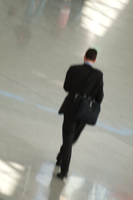 Businessman Walking in Airport Terminal