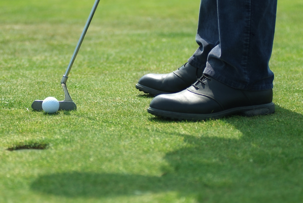 Golfer Lining Up Putt