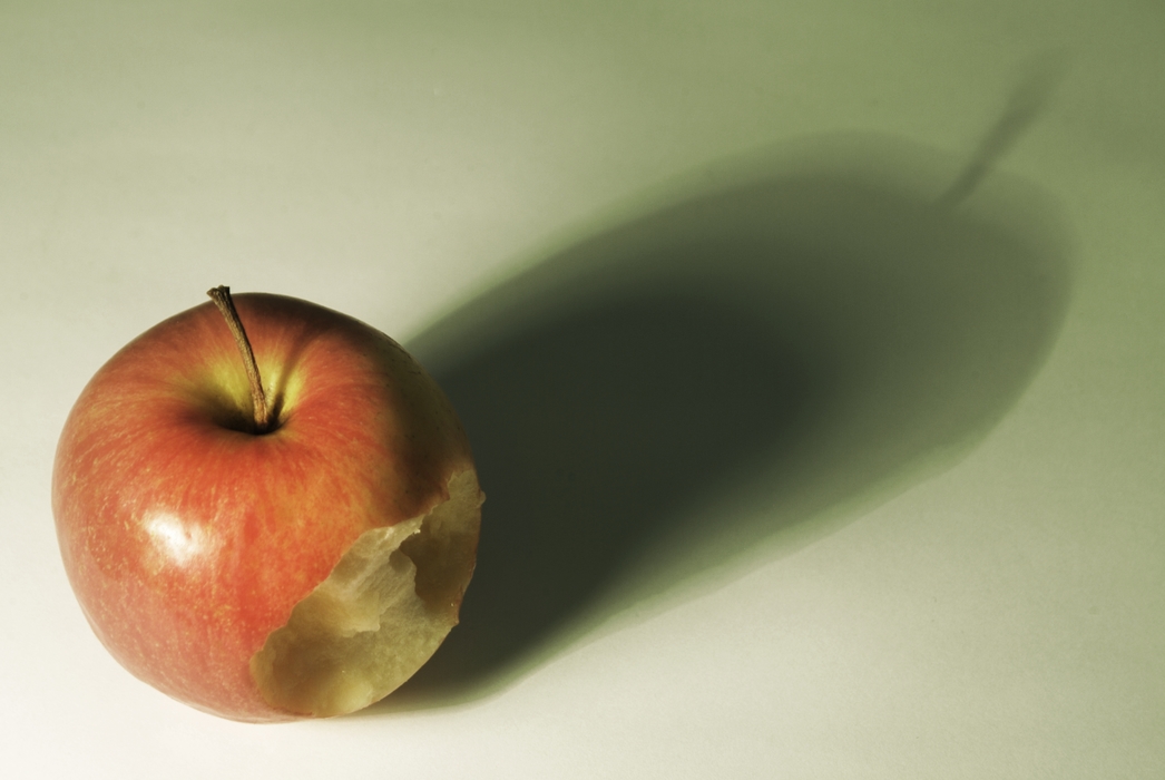 Taking a Bite Out of an Apple with Dramatic Shadow