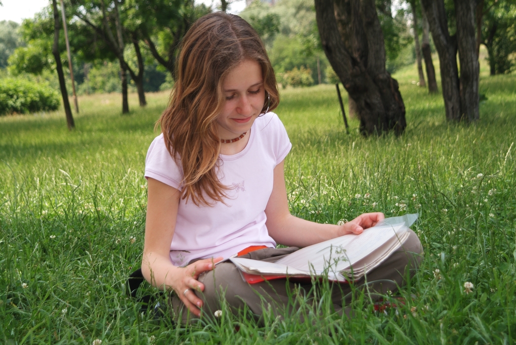 Girls Reading Book in the Park