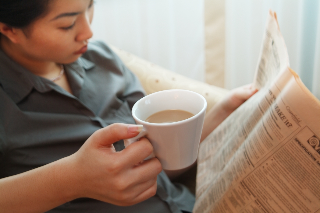 Businesswoman Reading Newspaper