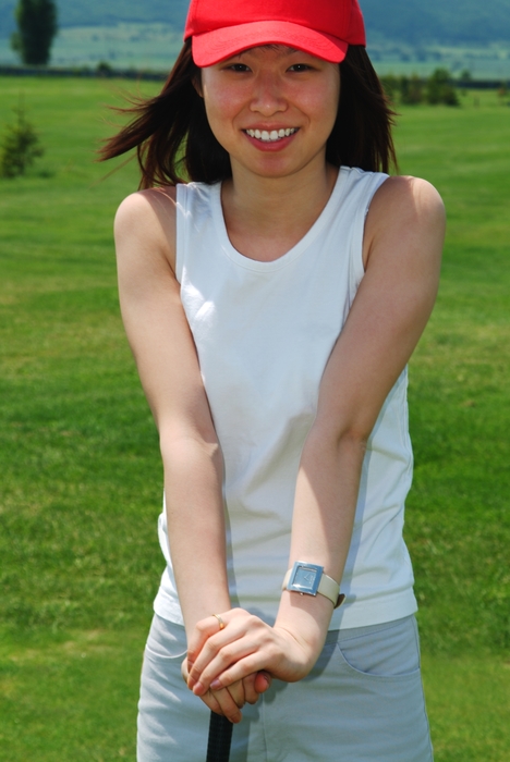 Female Golfer Holding Golf Club