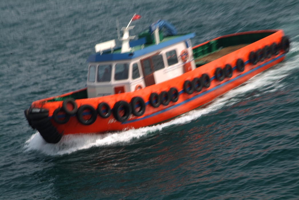 Tugboat Moving Through Water