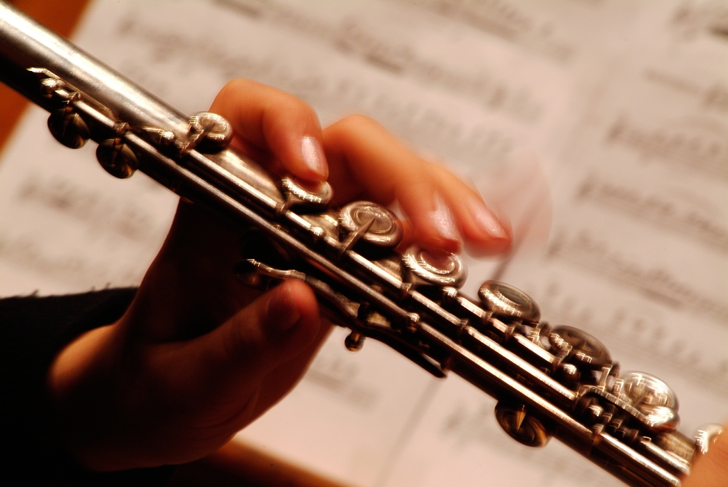 Orchestral Flutist Fingers on Keys