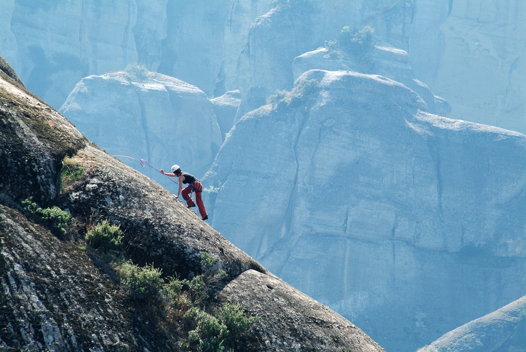 Mountain Climber on Steep Terrain