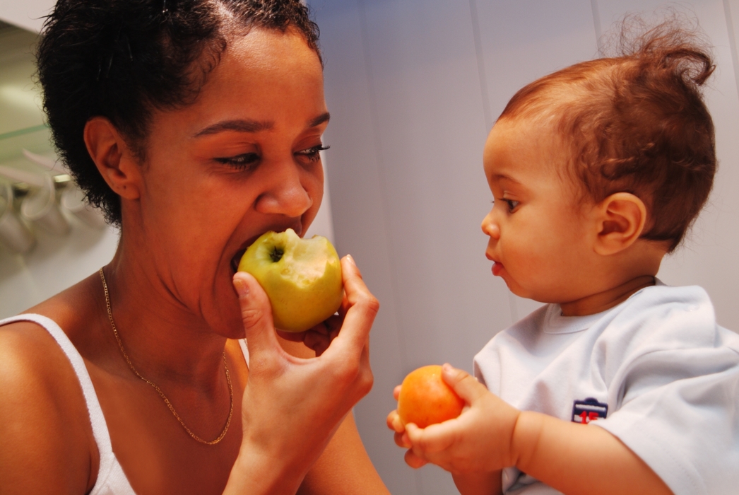 Mother and Daughter Having Breakfast