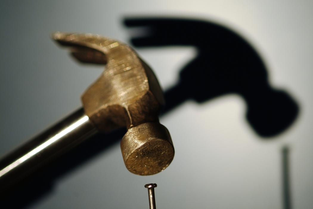 Hammer Hitting a Nail with Shadow