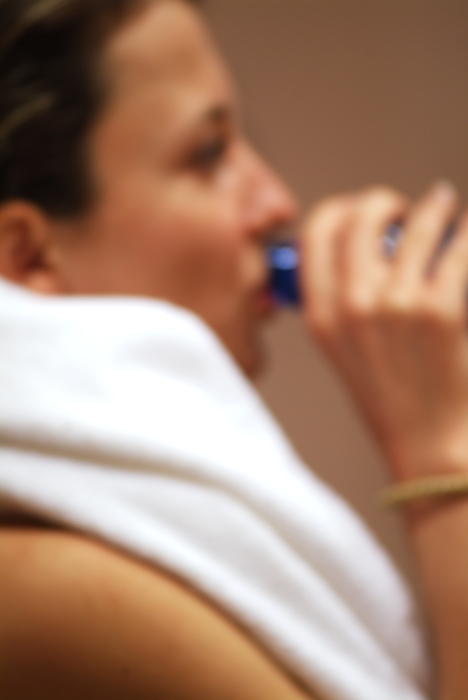 Woman Drinking Water After Workout