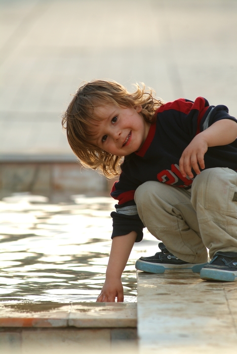 Boy Playing in The Water