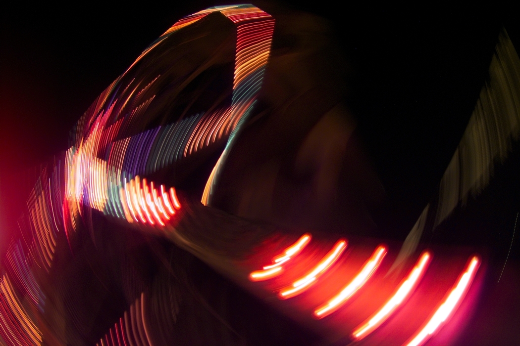 Amusement Park Ride with Colorful Lights at Night