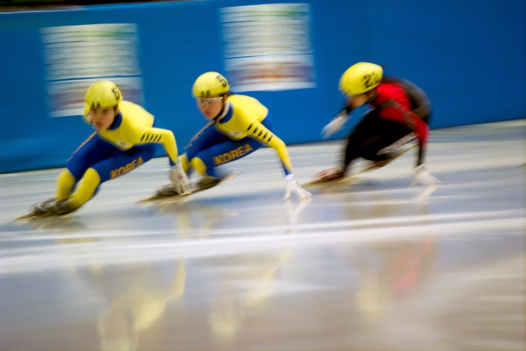 Speed Skaters into the Last Turn