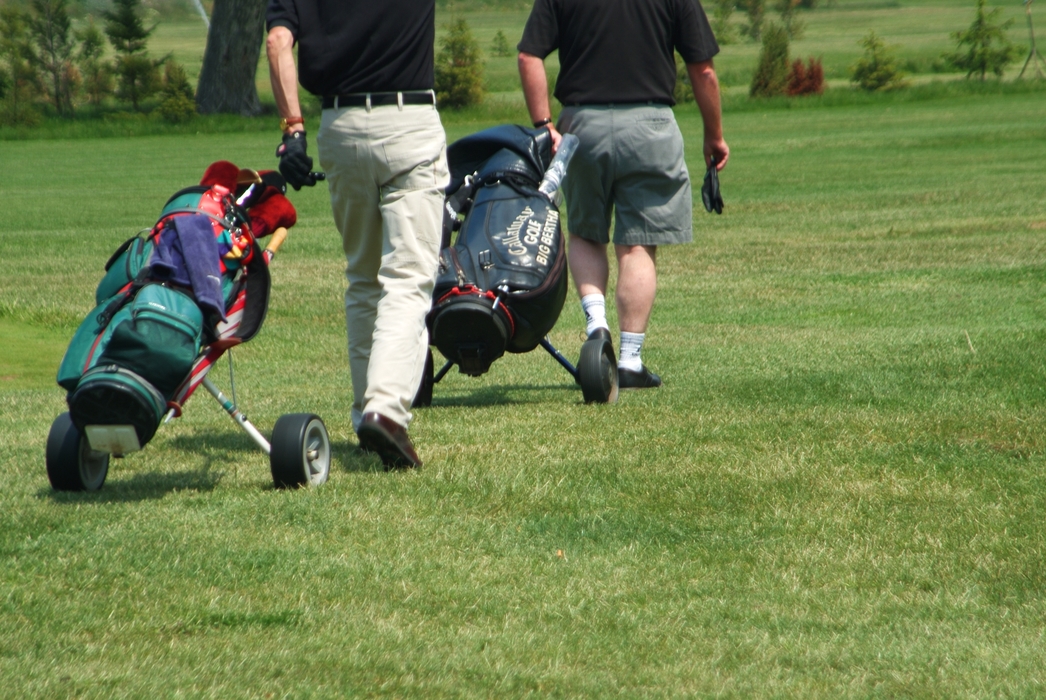 Golfers Walking to The Next Hole