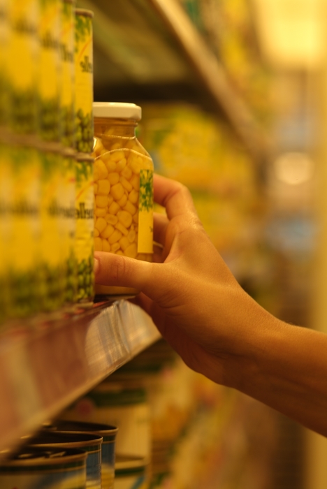 Selecting a Product From Shelf at Supermarket