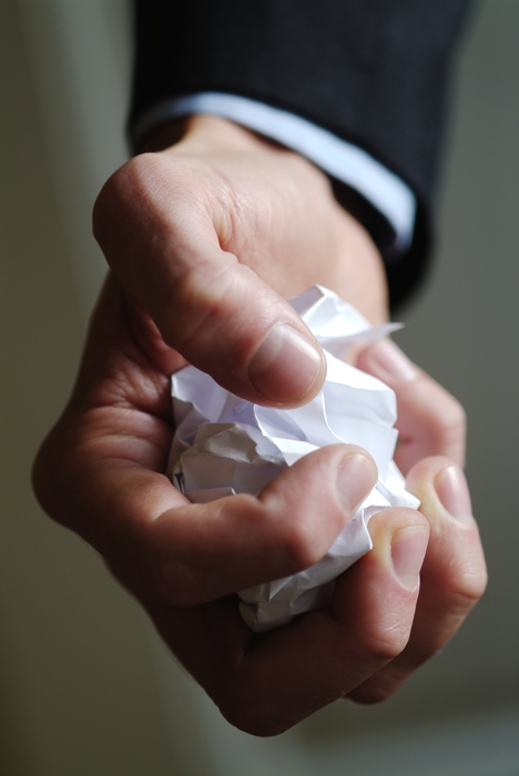 Hand Holding Crumpled Paper