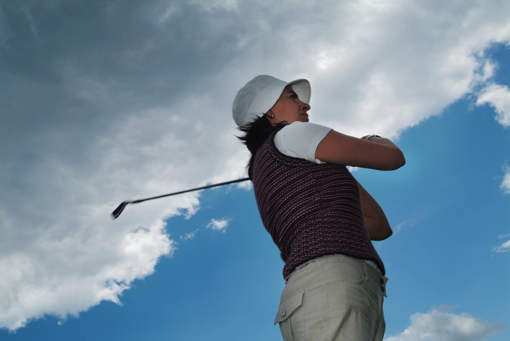 Female Golfer Watching Shot