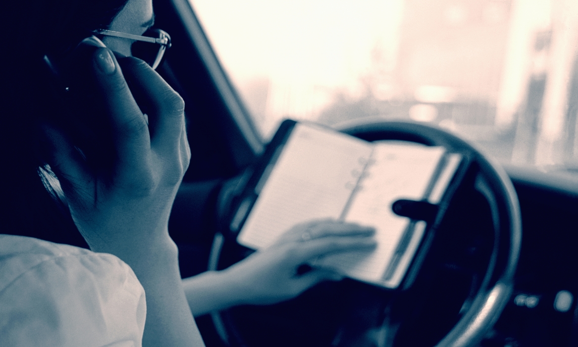 Woman Multitasking While Driving