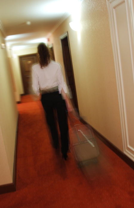 Businesswoman Leaving Hotel Room